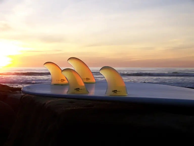 Closeup DK Surfboards Tail Fins Sunset Beach